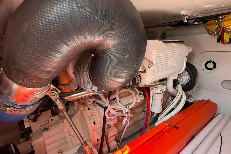 Slide: The Image of Engine room of 2006 Tiara Yachts 3900 Convertible, showcasing mechanical components and piping. - 47