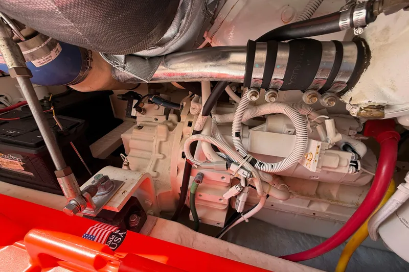 Slide: The Image of Engine compartment of a 2006 Tiara Yachts 3900 Convertible, showcasing mechanical components. - 49