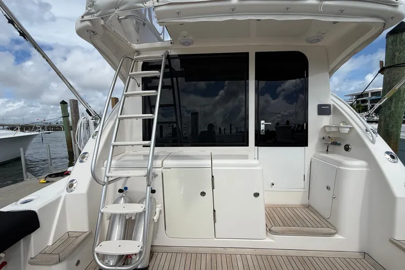 Slide: The Image of 2006 Tiara Yachts 3900 Convertible boat deck with ladder and storage compartments. - 6