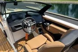 Slide: The Image of 2025 MasterCraft X24 boat interior with sleek design and modern dashboard. - 17