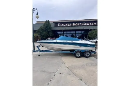 Slide: The Image of 1995 Chaparral 1930 SS boat on trailer outside Tracker Boat Center. - 3