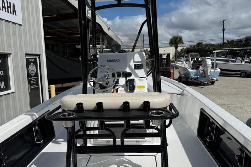 Slide: The Image of 2026 Blazer PureBay 2400 boat interior with steering console and seating. - 11