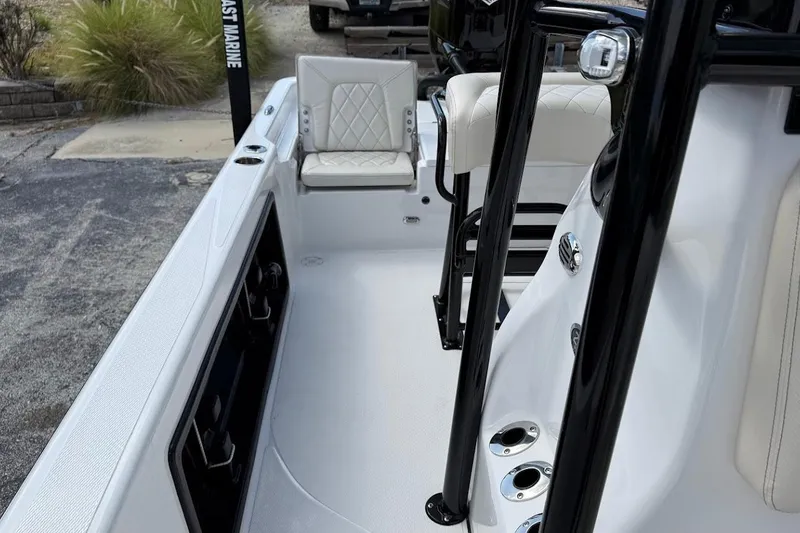 Slide: The Image of 2026 Blazer PureBay 2400 boat interior with white seating and black accents. - 17