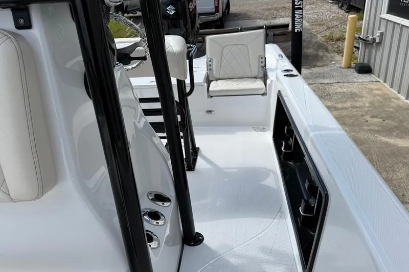 Slide: The Image of 2026 Blazer PureBay 2400 boat interior with white seating and black accents. - 18