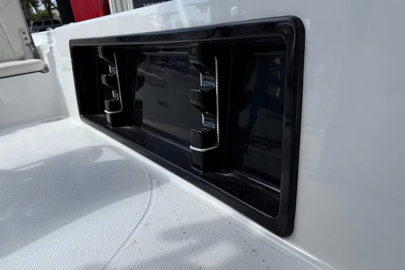 Slide: The Image of 2026 Blazer PureBay 2400 boat interior detail with built-in storage compartment. - 19