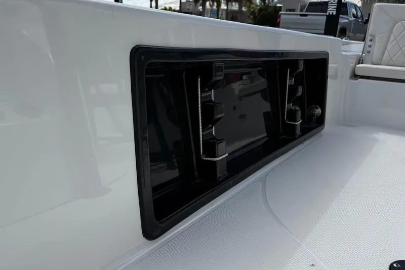 Slide: The Image of 2026 Blazer PureBay 2400 boat interior with storage compartment and seating. - 20