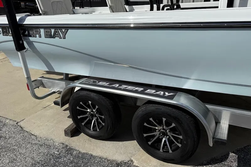 Slide: The Image of 2026 Blazer PureBay 2400 boat on trailer with stylish wheels. - 3