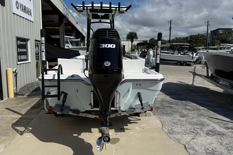 Slide: The Image of 2026 Blazer PureBay 2400 boat with powerful 300 HP engine at West Coast Marine. - 9