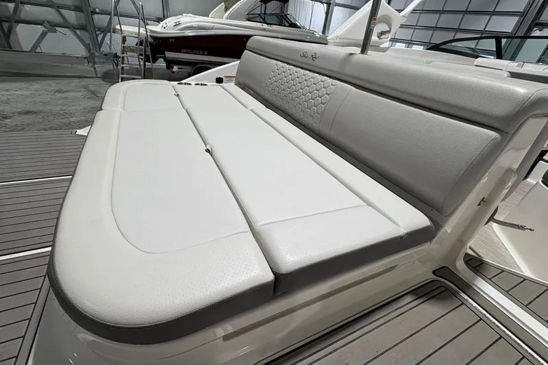 Slide: The Image of 2022 Sea Ray SDX 270 Outboard boat with open storage compartment and custom name. - 16