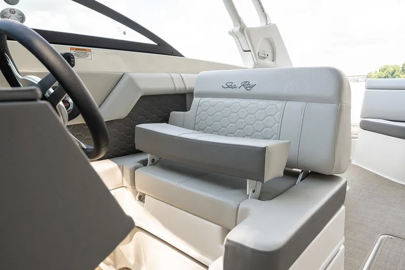 Slide: The Image of 2022 Sea Ray SDX 270 Outboard storage compartment with cushioned interior. - 21