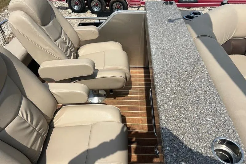Slide: The Image of Luxurious seating and granite countertop on 2018 SunChaser 326 boat interior. - 9
