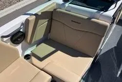 Slide: The Image of 2025 MasterCraft NXT22 boat interior with beige seating and modern design. - 10