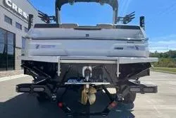 Slide: The Image of 2025 MasterCraft NXT22 boat rear view, showcasing sleek design and modern features. - 4