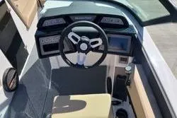 Slide: The Image of 2025 MasterCraft NXT22 boat dashboard with modern steering and controls. - 5