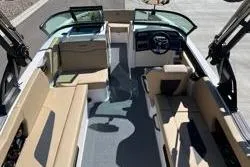 Slide: The Image of 2025 MasterCraft NXT22 boat interior with spacious seating and modern dashboard. - 7