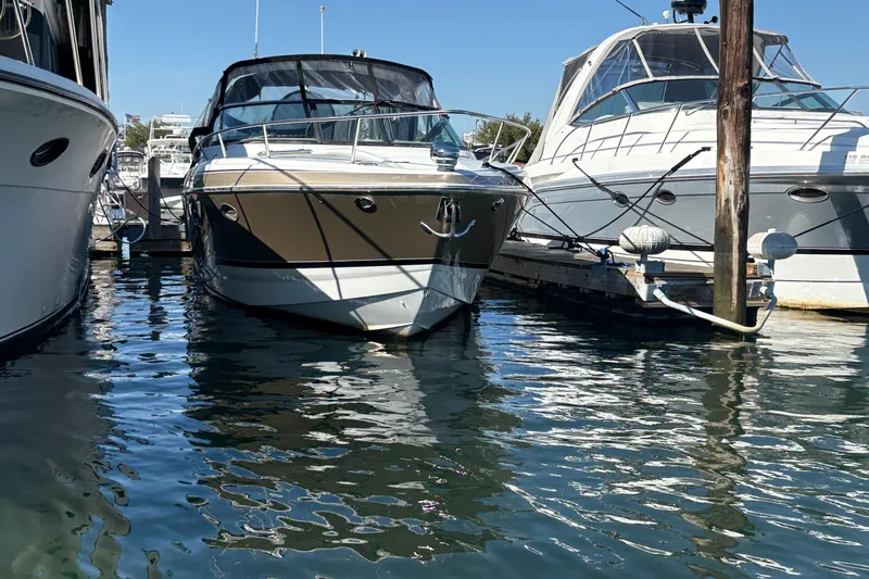 Slide: The Image of 2008 Formula 350 Sun Sport docked between two boats in a marina. - 1