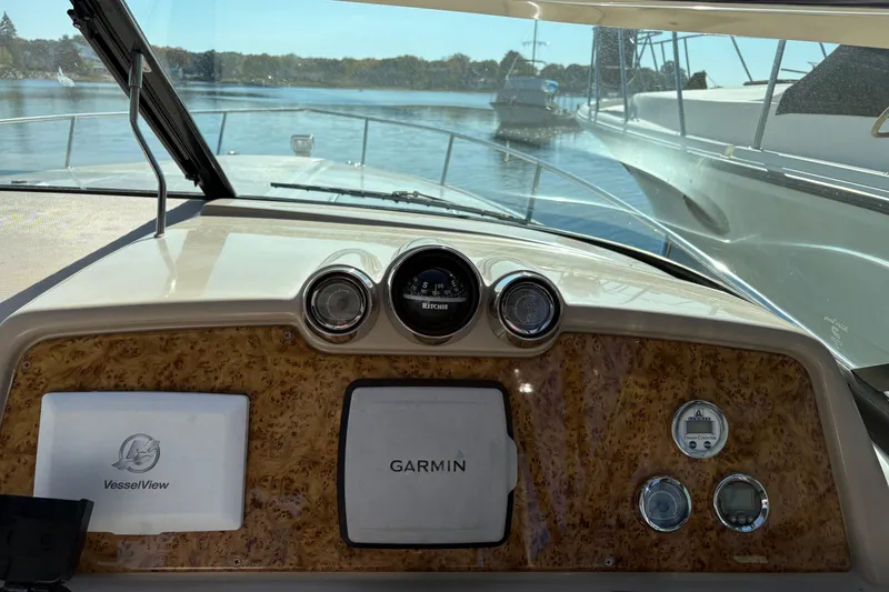 Slide: The Image of Dashboard view of a 2008 Formula 350 Sun Sport boat with Garmin navigation. - 12