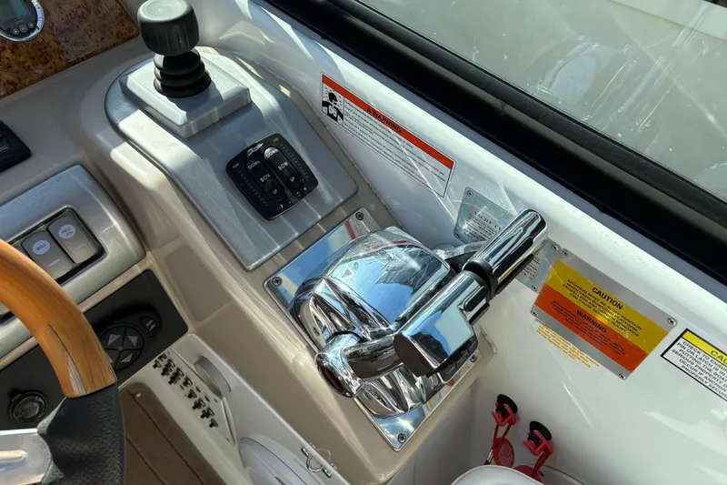Slide: The Image of Control panel of a 2008 Formula 350 Sun Sport boat with throttle and joystick. - 13