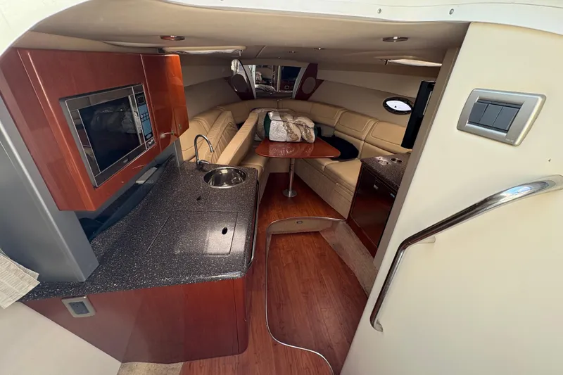 Slide: The Image of Interior of 2008 Formula 350 Sun Sport boat with kitchenette and seating area. - 15