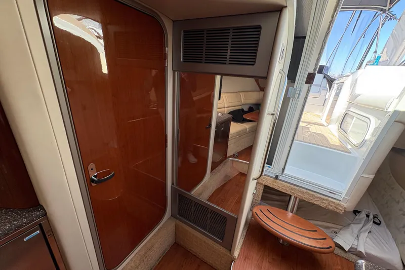 Slide: The Image of Interior of 2008 Formula 350 Sun Sport boat with wooden finishes and seating area. - 17