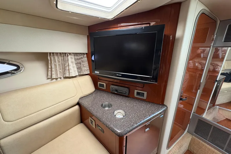 Slide: The Image of Interior of 2008 Formula 350 Sun Sport with TV, seating, and countertop. - 19