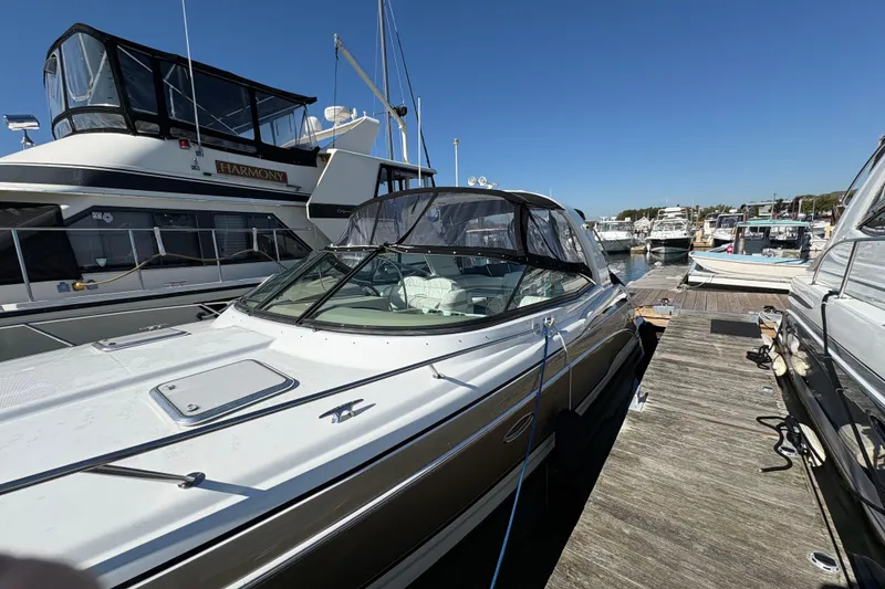 Slide: The Image of 2008 Formula 350 Sun Sport boat docked at marina under clear blue sky. - 4