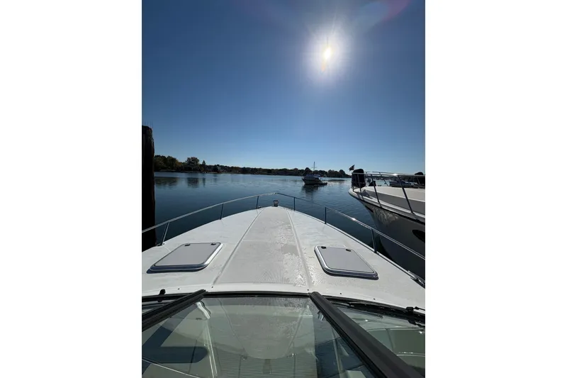 Slide: The Image of 2008 Formula 350 Sun Sport boat on calm water under bright sun. - 7
