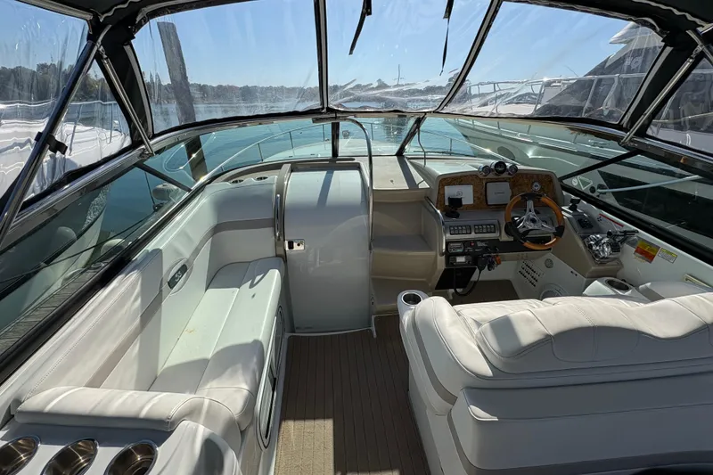 Slide: The Image of 2008 Formula 350 Sun Sport boat interior with helm, seating, and dashboard controls. - 8