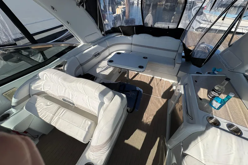 Slide: The Image of 2008 Formula 350 Sun Sport boat interior with white seating and table. - 9