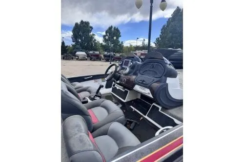 Slide: The Image of 1998 Nitro 700 LX DC boat interior with steering wheel and seating. - 3