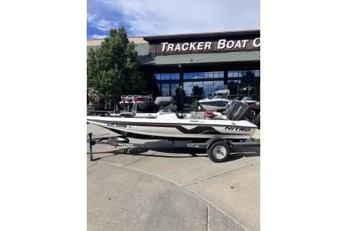Slide: The Image of 1998 Nitro 700 LX DC boat on trailer outside Tracker Boat Center. - 4