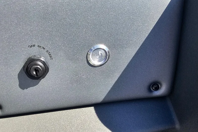 Slide: The Image of Control panel of 2026 Sun Tracker Party Barge 22 RF XP3 with ignition switch. - 13