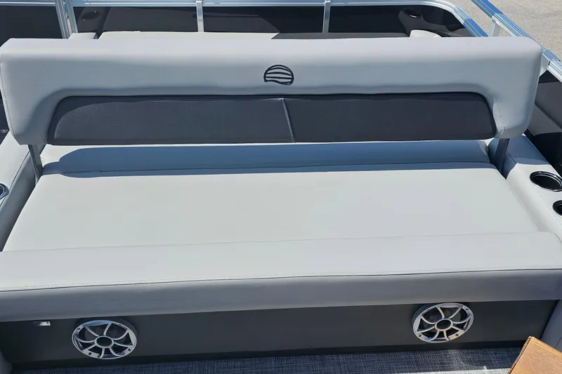 Slide: The Image of 2026 Sun Tracker Party Barge 22 RF XP3 seating area with speakers and cup holders. - 16