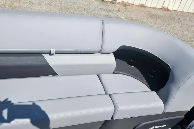 Slide: The Image of 2026 Sun Tracker Party Barge 22 RF XP3, featuring sleek gray seating. - 7