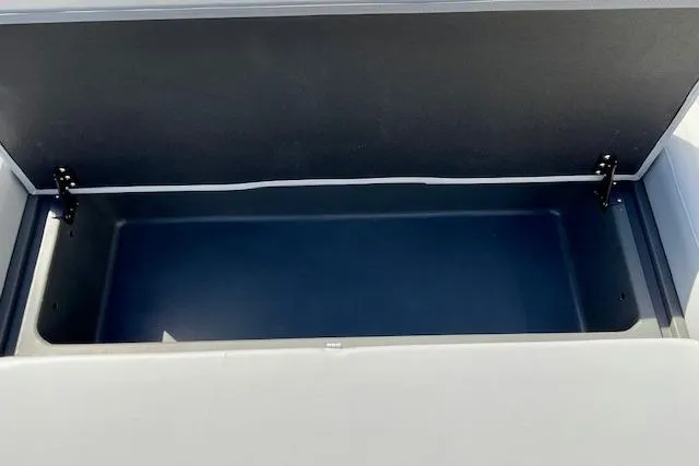Slide: The Image of Open storage compartment on 2026 Sun Tracker Party Barge 22 RF XP3 boat. - 13
