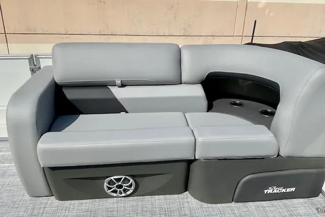 Slide: The Image of 2026 Sun Tracker Party Barge 22 RF XP3, featuring sleek gray seating and integrated speaker. - 16