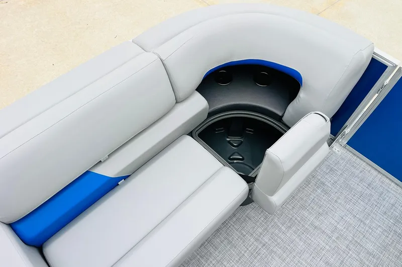 Slide: The Image of 2026 Sun Tracker Party Barge 22 RF DLX seating area with storage compartment. - 17