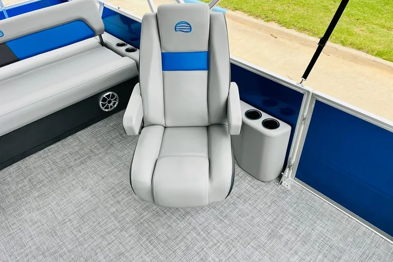 Slide: The Image of 2026 Sun Tracker Party Barge 22 RF DLX interior with gray seating and cup holders. - 29