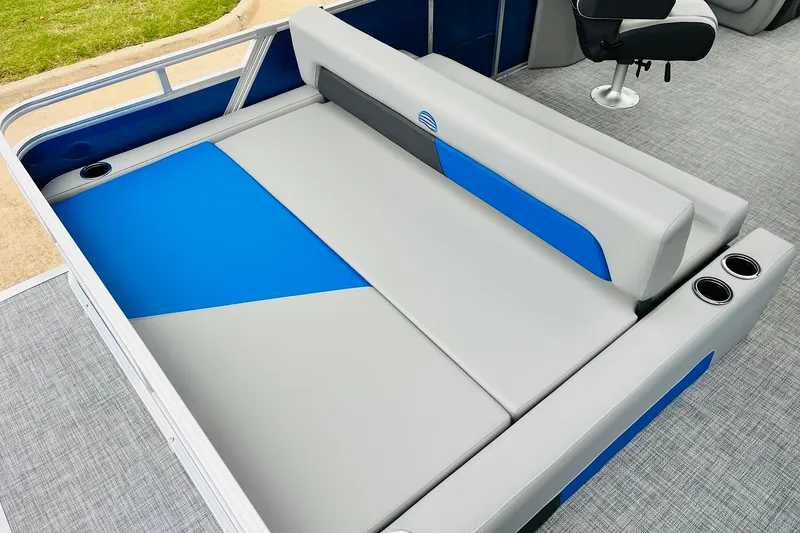 Slide: The Image of 2026 Sun Tracker Party Barge 22 RF DLX interior with blue and gray seating. - 41