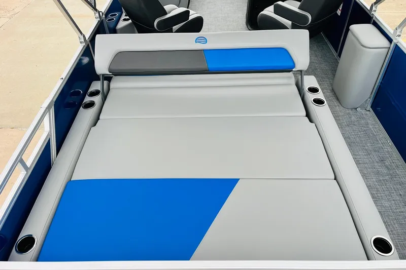 Slide: The Image of 2026 Sun Tracker Party Barge 22 RF DLX interior with blue and gray seating. - 43