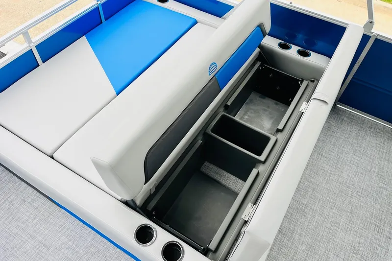 Slide: The Image of 2026 Sun Tracker Party Barge 22 RF DLX interior with storage compartments and cup holders. - 45