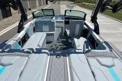 Slide: The Image of 2025 MasterCraft XT22 boat interior with sleek seating and modern design. - 14