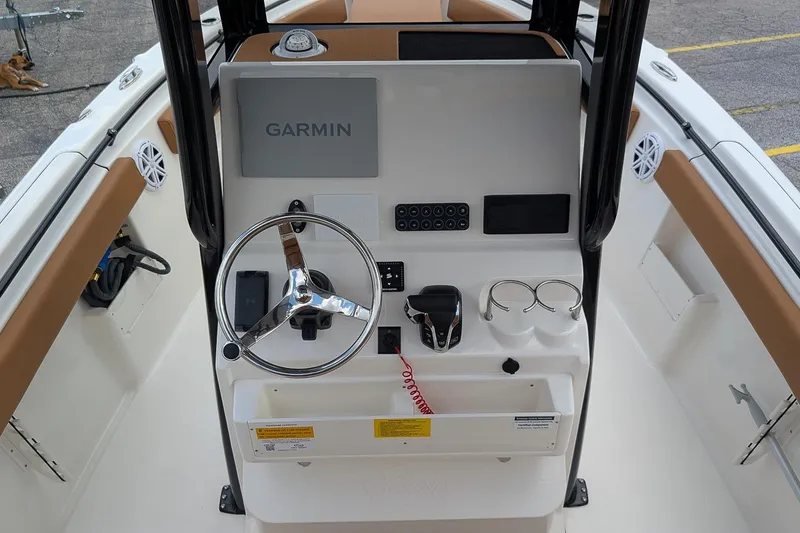 Slide: The Image of 2026 Key West 239 FSR boat console with Garmin navigation system and steering wheel. - 14