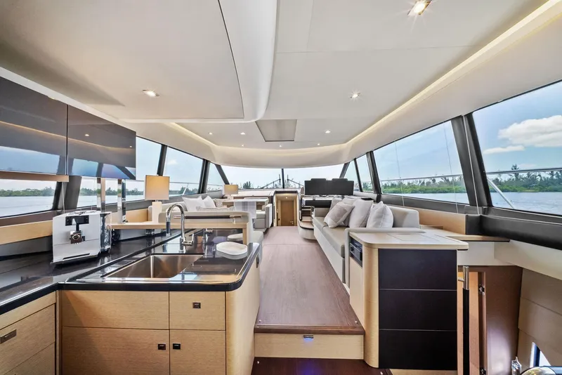 Slide: The Image of Luxurious interior of 2017 Prestige 560 Flybridge yacht with modern kitchen and seating area. - 34