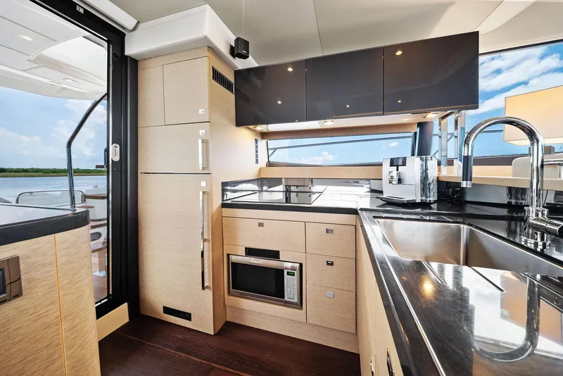 Slide: The Image of Luxurious kitchen interior of 2017 Prestige 560 Flybridge yacht with modern appliances and sleek design. - 35