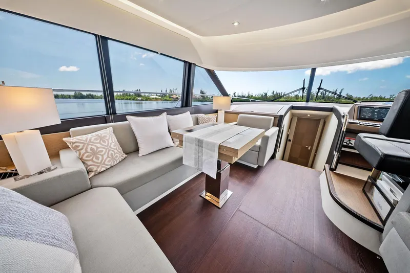 Slide: The Image of Luxurious interior of 2017 Prestige 560 Flybridge yacht with elegant seating and panoramic windows. - 40