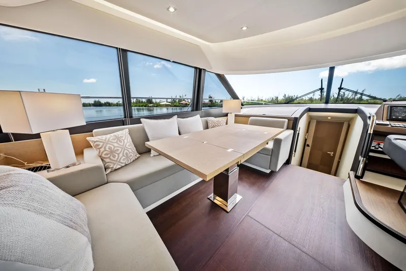 Slide: The Image of Luxurious interior of 2017 Prestige 560 Flybridge yacht with elegant seating and panoramic windows. - 41