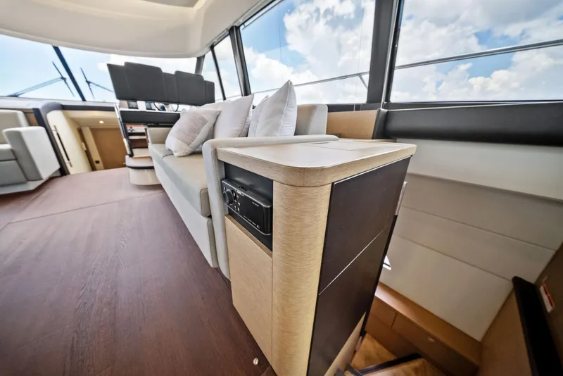 Slide: The Image of Luxurious interior of 2017 Prestige 560 Flybridge yacht with modern seating and panoramic windows. - 45