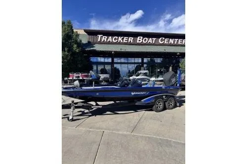 Slide: The Image of 2022 Phoenix 921 ELITE boat at Tracker Boat Center, parked outdoors. - 3