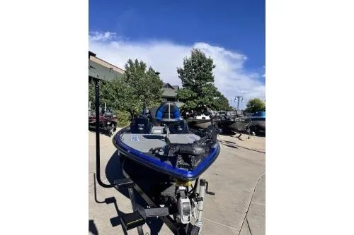 Slide: The Image of 2022 Phoenix 921 ELITE boat parked outdoors on a sunny day. - 4